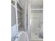 Bathroom with shower, sink, and built-in shelving at 107 E Garfield St, Alexandria, IN 46001