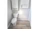 Bathroom with toilet and wood-look flooring at 107 E Garfield St, Alexandria, IN 46001