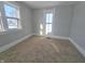 Bright bedroom with neutral walls and carpeting at 107 E Garfield St, Alexandria, IN 46001