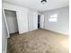 Bedroom with neutral walls, carpet flooring and built-in closet at 107 E Garfield St, Alexandria, IN 46001