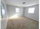 Spacious bedroom with neutral walls, carpet flooring and sunlight at 107 E Garfield St, Alexandria, IN 46001