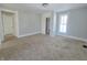 Spacious bedroom featuring neutral carpeting and built-in closet at 107 E Garfield St, Alexandria, IN 46001