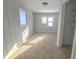 Charming bedroom with neutral carpet and window views at 107 E Garfield St, Alexandria, IN 46001