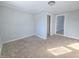 Spacious bedroom with neutral carpeting and closet at 107 E Garfield St, Alexandria, IN 46001