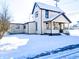 Two-story house with a snow covered yard at 107 E Garfield St, Alexandria, IN 46001