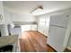 Bright kitchen with white cabinets and wood floors at 107 E Garfield St, Alexandria, IN 46001