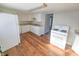 Kitchen with white cabinets and wood floors at 107 E Garfield St, Alexandria, IN 46001