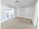 Living room with carpet flooring and access to other rooms at 107 E Garfield St, Alexandria, IN 46001