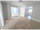 Living room with carpet flooring and access to other rooms at 107 E Garfield St, Alexandria, IN 46001