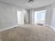 Living room with carpet flooring and access to other rooms at 107 E Garfield St, Alexandria, IN 46001