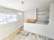 Simple sunroom with white walls and wood floors at 107 E Garfield St, Alexandria, IN 46001