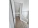Upper level hallway with staircase and attic access at 107 E Garfield St, Alexandria, IN 46001