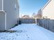 Snowy backyard with privacy fence at 10968 Gossamer Ln, Noblesville, IN 46060