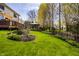 Serene backyard with a wooden deck and gazebo, perfect for outdoor entertaining and enjoying nature at 12596 Autumn Gate Way, Carmel, IN 46033