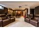 Spacious finished basement featuring a home theater and a bar area at 12596 Autumn Gate Way, Carmel, IN 46033