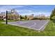 Community basketball court offers residents an outdoor recreation area with new backboards and professional striping at 12596 Autumn Gate Way, Carmel, IN 46033
