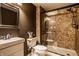 Well-lit bathroom featuring a modern shower with glass door, and a modern vanity at 12596 Autumn Gate Way, Carmel, IN 46033