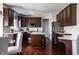 Kitchen featuring dark cabinetry, stainless steel appliances, and a center island at 12596 Autumn Gate Way, Carmel, IN 46033
