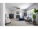 Bright living room with a fireplace, large window, and neutral color scheme at 12596 Autumn Gate Way, Carmel, IN 46033