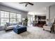 Spacious open-concept living area with an attached kitchen and ample natural light at 12596 Autumn Gate Way, Carmel, IN 46033