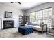 Cozy living room with a fireplace, comfortable seating, and plenty of natural light at 12596 Autumn Gate Way, Carmel, IN 46033