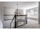 Bright loft area featuring large windows with a window seat and a chandelier at 12596 Autumn Gate Way, Carmel, IN 46033