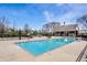 Community pool with lounge chairs and a pavilion, offering a relaxing place to socialize in a private neighborhood at 12596 Autumn Gate Way, Carmel, IN 46033