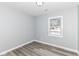 Bedroom with a window and wood-look floors at 1305 Woodbine Dr, Anderson, IN 46011