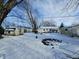 Snowy backyard with shed, trees, and partially fenced area at 13146 N Paddock Rd, Camby, IN 46113