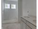 Bright bathroom with a double sink and a standing shower at 13359 Vickery Ridge Dr, Fishers, IN 46037