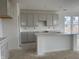 Bright kitchen featuring shaker cabinets, quartz countertops, and a spacious island at 13359 Vickery Ridge Dr, Fishers, IN 46037