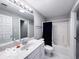 Bathroom featuring a single vanity, shower and tub combo, and plenty of light at 13650 Golden Ridge Ln, Fishers, IN 46055