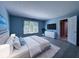 Bedroom featuring neutral colored paint, a large bed, and natural light from the window at 13650 Golden Ridge Ln, Fishers, IN 46055