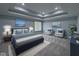 Bedroom featuring a large bed, seating area, tray ceiling and view of the water at 13650 Golden Ridge Ln, Fishers, IN 46055