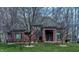 Charming brick home featuring a well-manicured lawn and mature trees at 13650 Golden Ridge Ln, Fishers, IN 46055