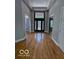 Grand foyer featuring hardwood floors and an elegant front door at 13650 Golden Ridge Ln, Fishers, IN 46055