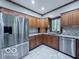 Kitchen featuring stainless steel appliances, countertops, and tile floors at 13650 Golden Ridge Ln, Fishers, IN 46055