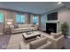 Comfortable living room with neutral-toned seating and fireplace at 13650 Golden Ridge Ln, Fishers, IN 46055