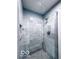 Tiled shower with glass door and built-in niche at 13650 Golden Ridge Ln, Fishers, IN 46055