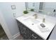 Bathroom vanity with white countertop and gray cabinets at 1442 N Illinois St # 19, Indianapolis, IN 46202