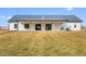 Spacious backyard featuring a covered patio, perfect for outdoor living and entertaining in a modern farmhouse style at 1600 S Morgantown Rd, Morgantown, IN 46160