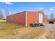 Exterior shot of large red barn on a grassy property, providing ample storage and potential at 1600 S Morgantown Rd, Morgantown, IN 46160