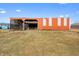 Exterior view of barn with open side and metal siding, set on a large open lot with lush green grass at 1600 S Morgantown Rd, Morgantown, IN 46160