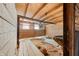 Dilapidated barn interior featuring rustic wood construction, abundant natural light, and storage potential at 1600 S Morgantown Rd, Morgantown, IN 46160
