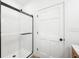 Modern bathroom features a sleek glass-enclosed shower with contemporary fixtures at 1600 S Morgantown Rd, Morgantown, IN 46160