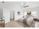 Serene bedroom with neutral tones, plush bedding, and ample natural light from the bright, large windows at 1600 S Morgantown Rd, Morgantown, IN 46160