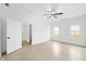 Bright and airy bedroom with polished concrete floors, a ceiling fan, and two windows with outside views at 1600 S Morgantown Rd, Morgantown, IN 46160