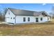 Modern farmhouse with bright white exterior and metal roof on a grassy field at 1600 S Morgantown Rd, Morgantown, IN 46160