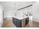 A sleek kitchen island with modern fixtures and stainless steel appliances set in an open concept space at 1600 S Morgantown Rd, Morgantown, IN 46160