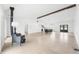 Spacious living room with a vintage stove, polished concrete floors, and an open floor plan at 1600 S Morgantown Rd, Morgantown, IN 46160